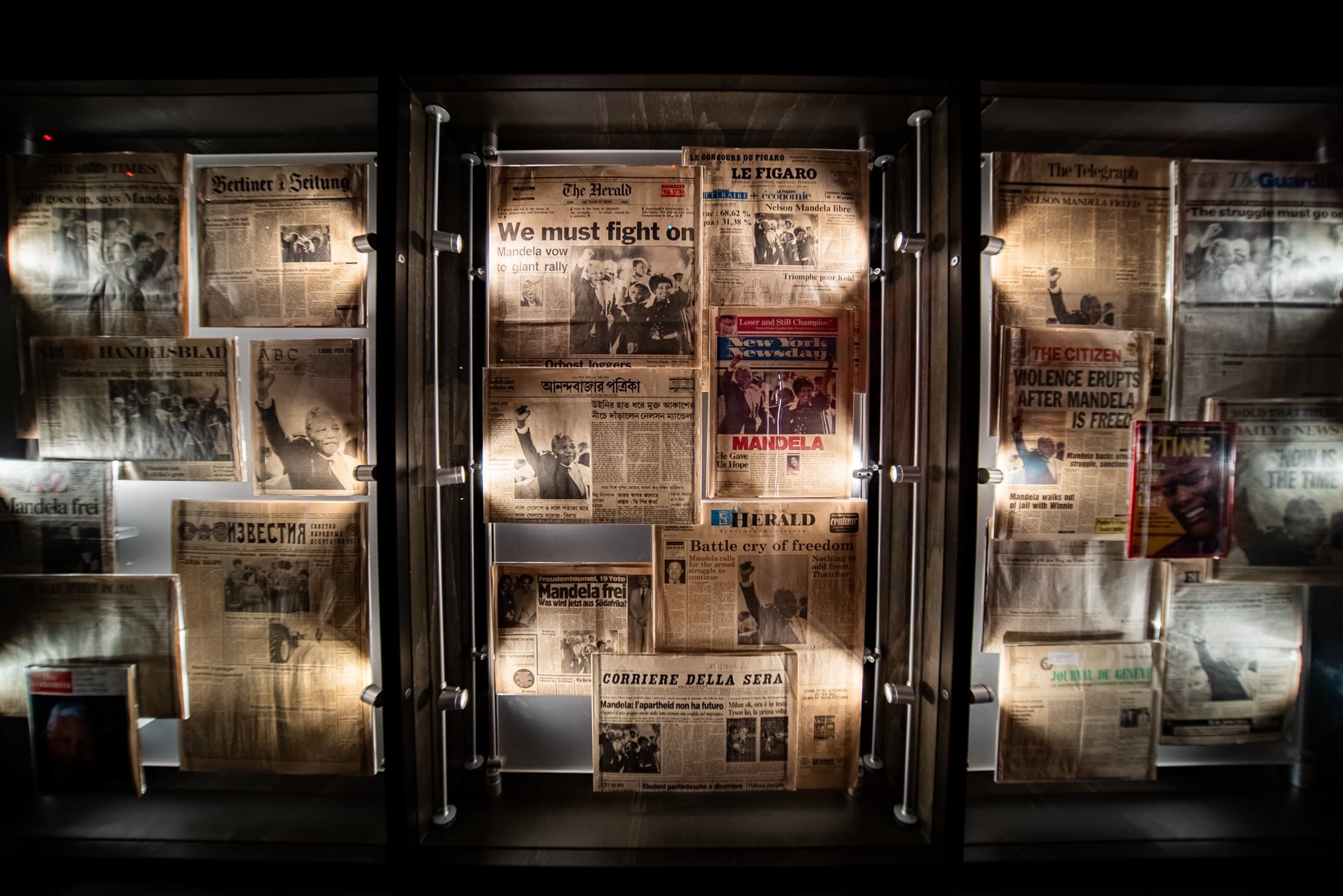 Newspaper front pages from around the world reporting Mandela's 1990 release, as displayed at an earlier stop of the touring exhibition. Photo courtesy of Round Room Live